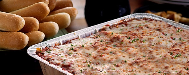 Ready-to-Bake Bundle includes a pan of Lasagna Classico, 1 gallon of soup, and 2 dozen breadsticks.